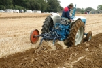 jim-brown-on-his-1964-new-performance-super-major-with-a-2-furrow-ransome-plough-2